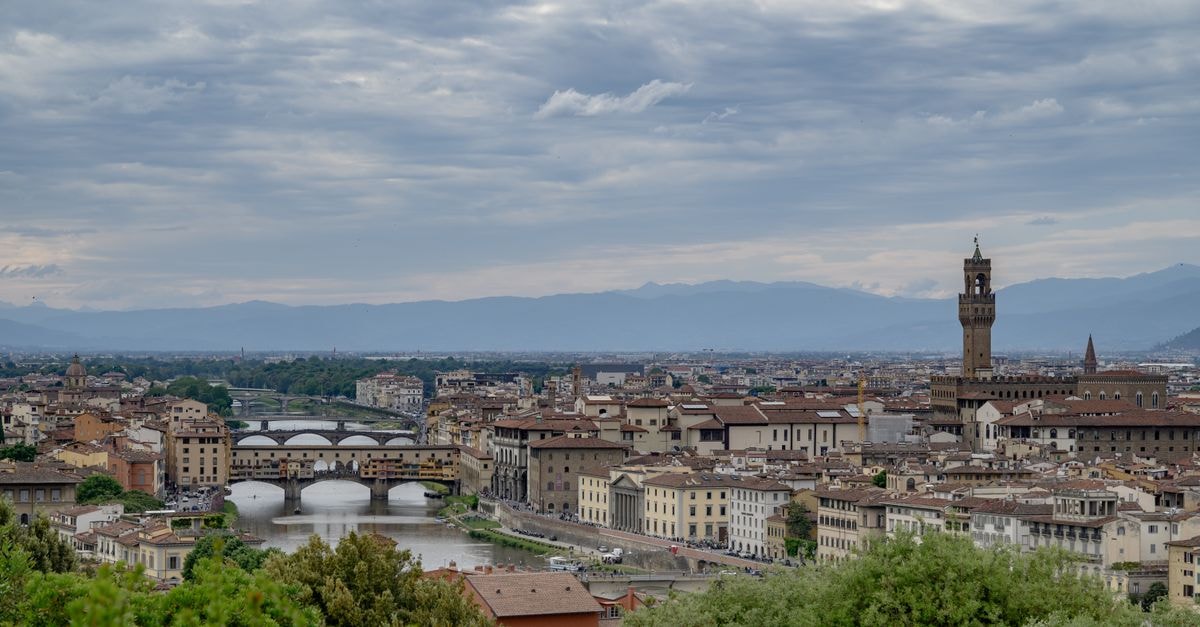 Relais Cavalcanti Guest House in Florence: A Cozy Bed & Breakfast Retreat A breathtaking panoramic view of Florence, Italy with iconic landmarks and bridges.