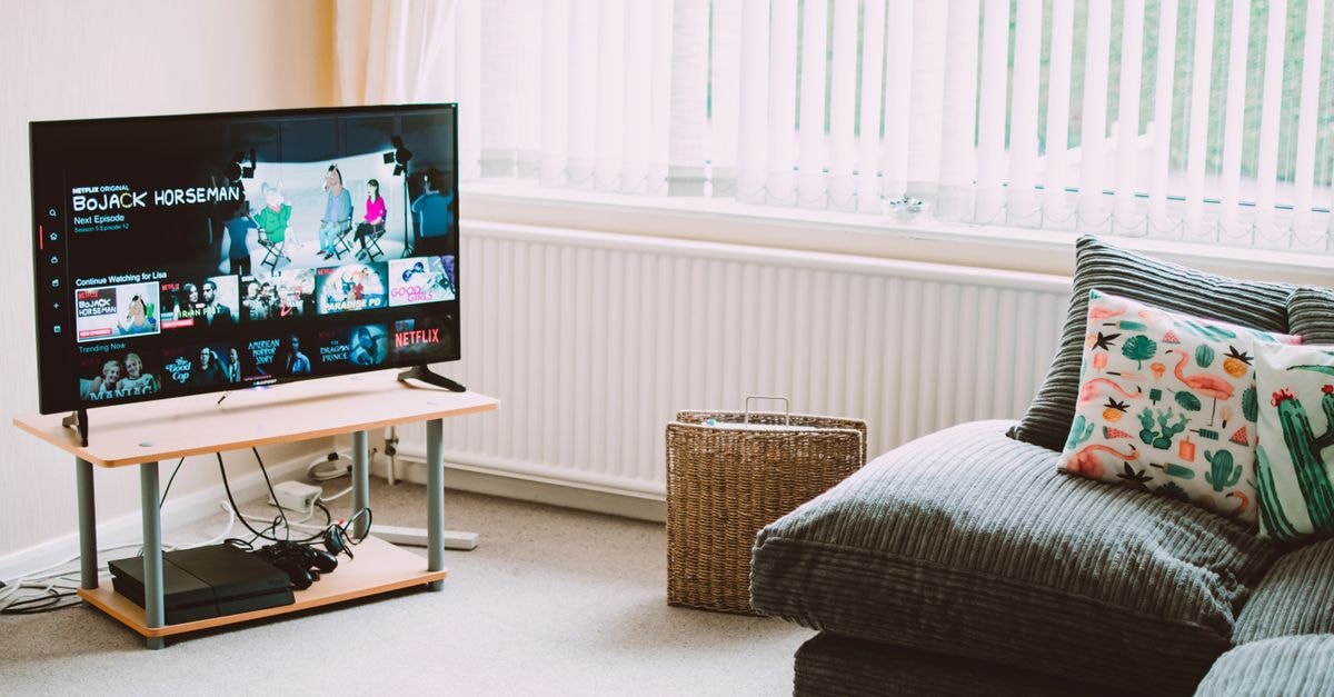 Cavaliers drop local pay-TV, sign multi-year DAZN streaming deal for 2026-27 season Chic and comfortable living room featuring a modern sofa, decorative pillows, and a TV streaming popular shows.