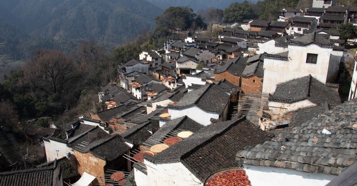 A picturesque view of traditional tiled rooftops in Wuyuan, Jiangxi, China, showcasing local architecture.