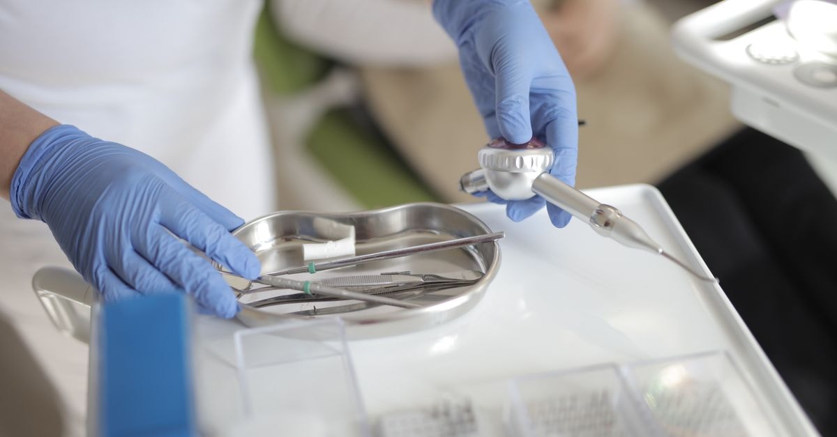 Delcath Systems: Quarter Shows Commercial Traction But Price Already Implies Much More Anonymous crop doctor in latex gloves taking metal medical instruments from table while preparing for treatment in modern clinic