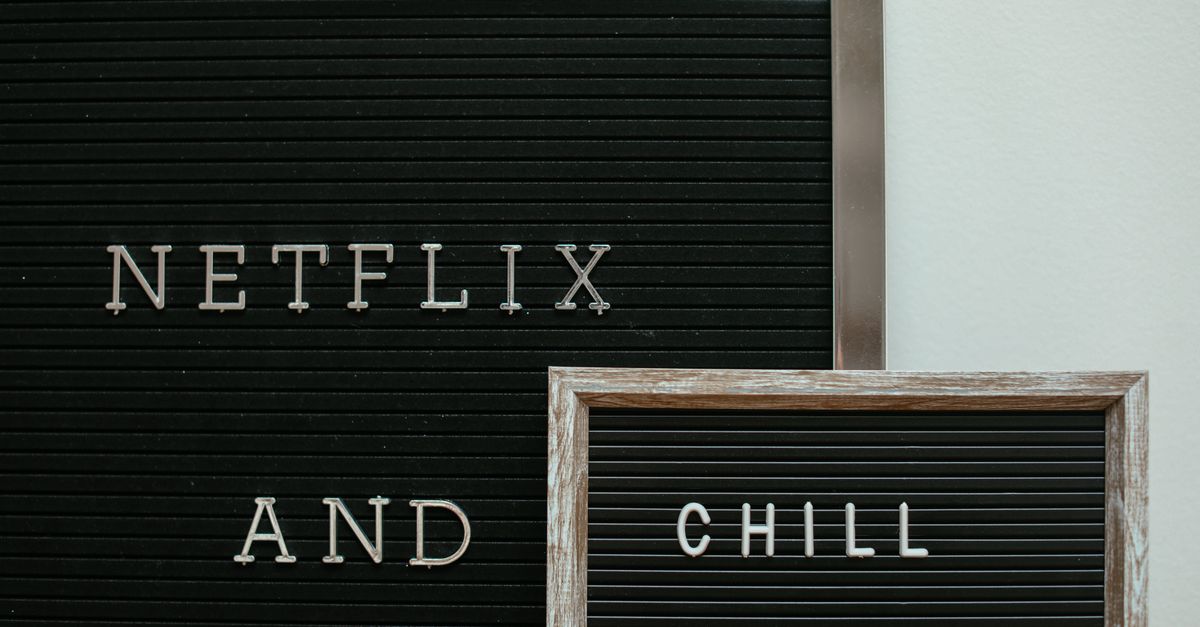 Netflix Eyes Letterboxd Acquisition and Hires First Betting-Ad Lead A letter board with the phrase 'Netflix and Chill' displayed in a minimalist style.