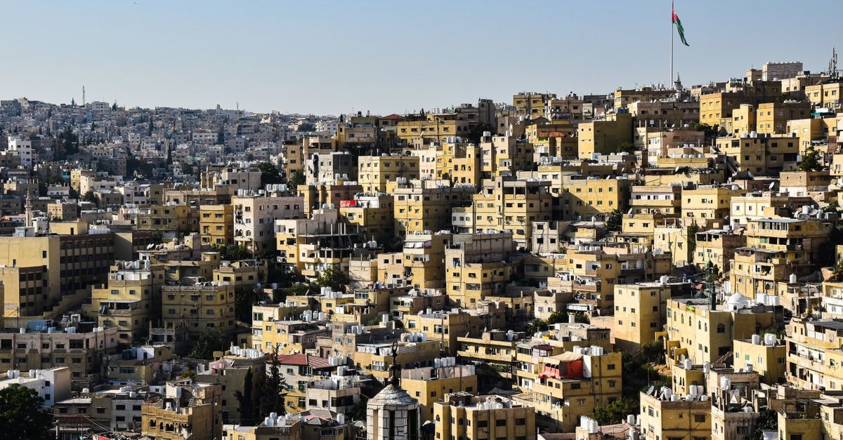 Discover the dense and historic cityscape of Amman, Jordan from a beautiful aerial perspective.