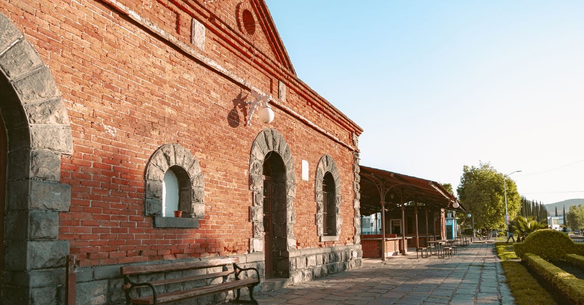 Charming historical brick architecture in Atlixco, Puebla, Mexico, bathed in warm daylight.