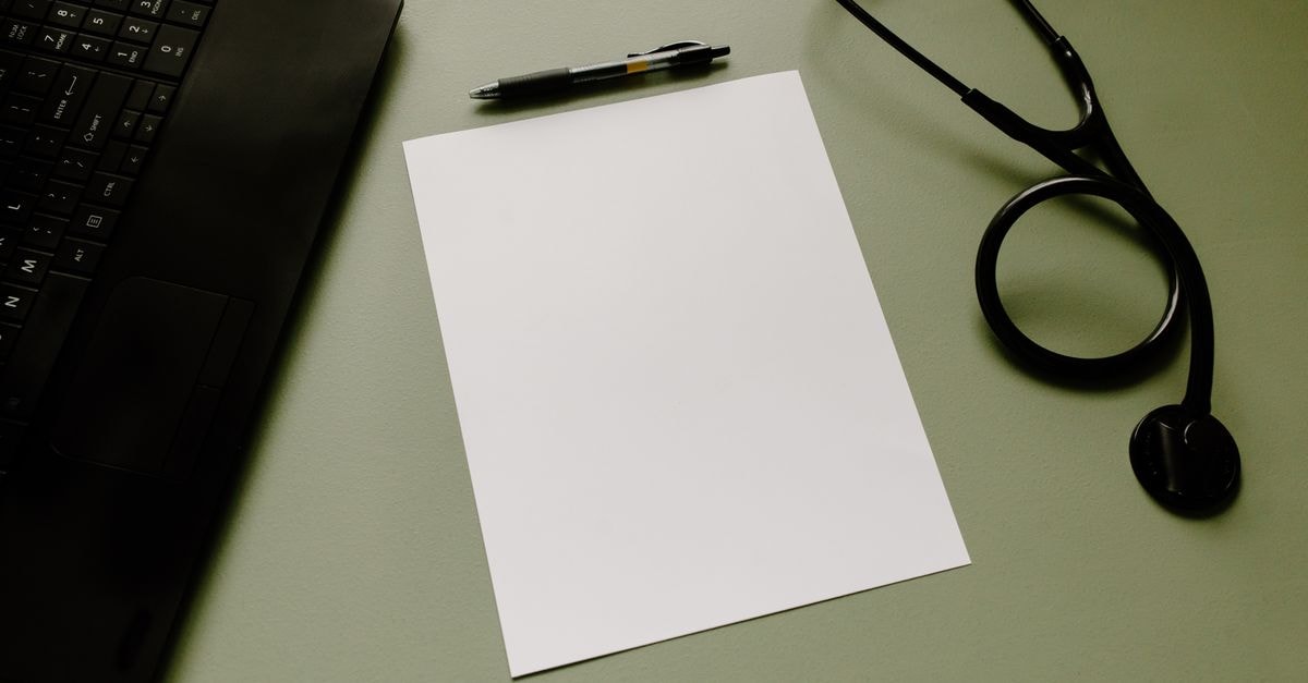 BillionToOne at $99.39: Strong Operations, Expensive Market Price Professional workspace featuring a laptop, stethoscope, pen, and paper sheet for healthcare tasks.