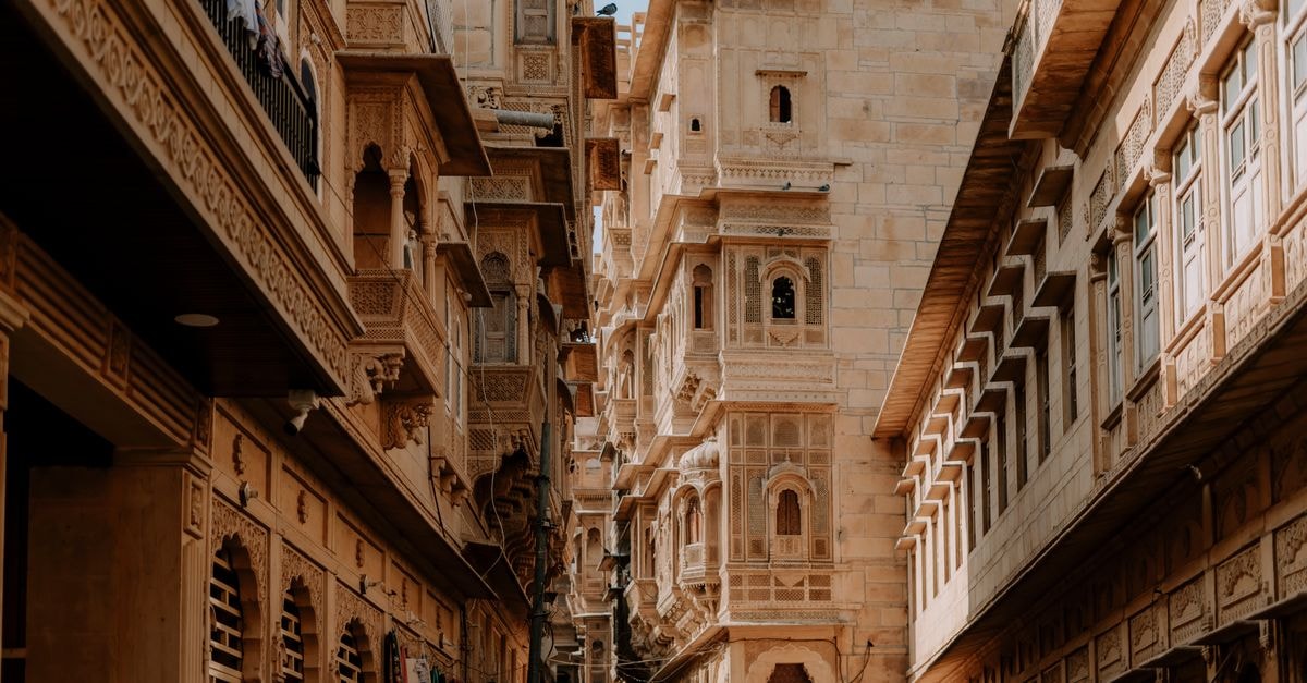 Stunning view of traditional Rajasthani architecture in Jaisalmer, showcasing intricate carvings and sandstone buildings.