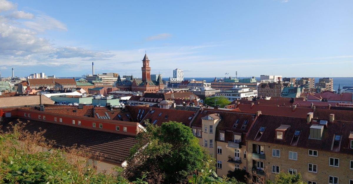 Scandic Hotel Karlskrona in Karlskrona: Sea-View Calm in a UNESCO City Panoramic view of Helsingborg's picturesque rooftops under a clear blue sky with coastal backdrop.