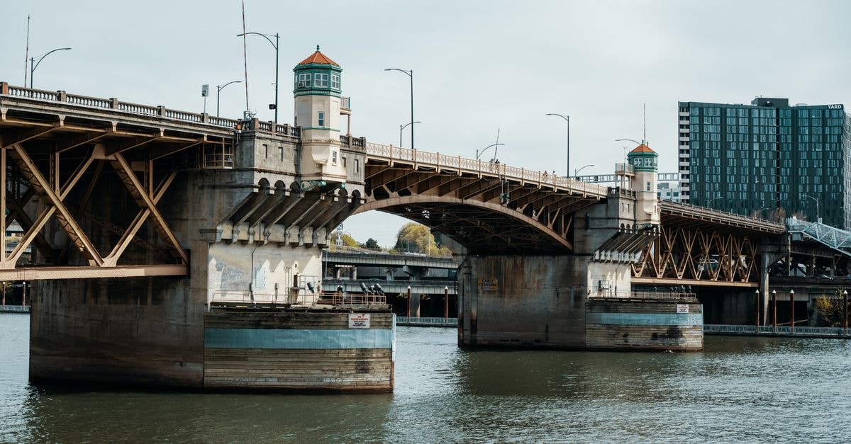 Portland, Oregon: An Evergreen Travel Guide to a City of Neighborhoods Daytime view of Burnside Bridge in Portland, Oregon, spanning the Willamette River.