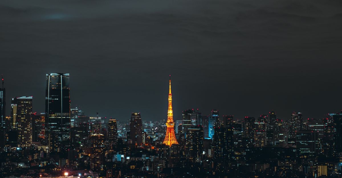 Stunning night view of Tokyo skyline featuring the illuminated Tokyo Tower.