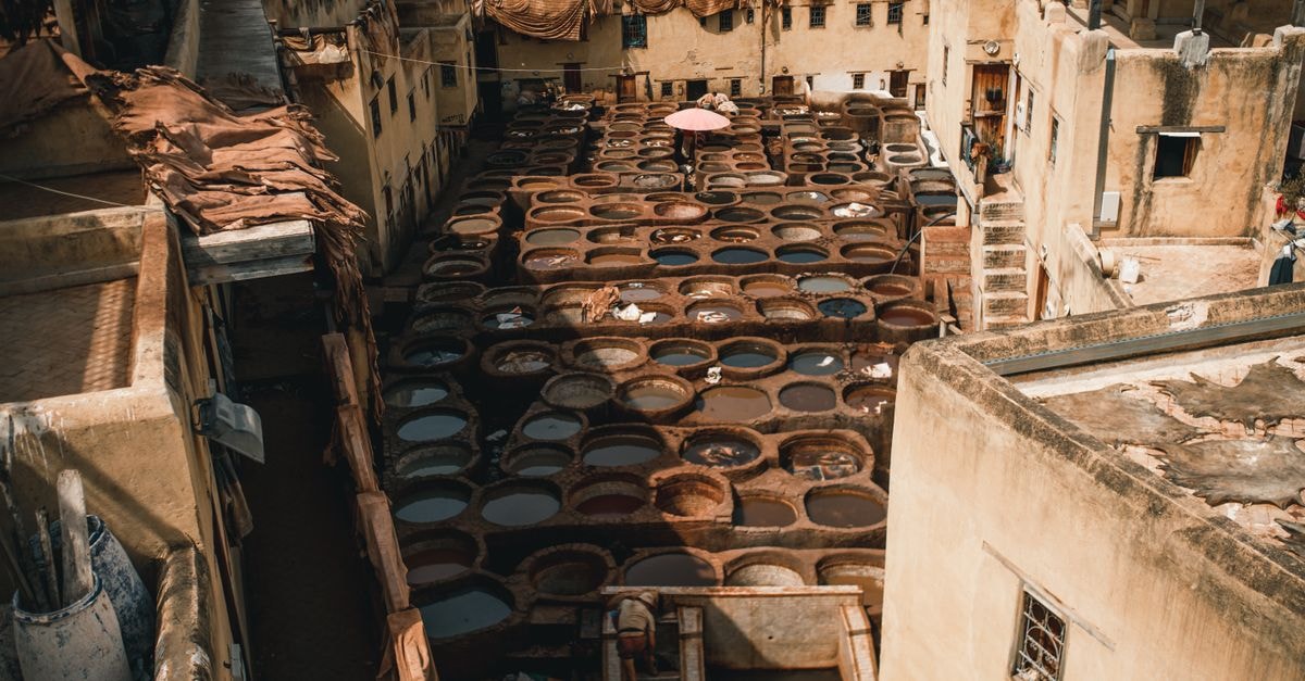 Hotel Rif in Meknes: Air-Conditioned Rooms Near Volubilis Explore the iconic Chouara Tannery in Fes, Morocco, showcasing traditional leather tanning methods from above.