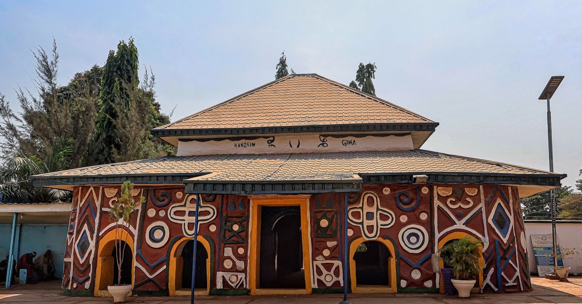 Colorful building with traditional geometric patterns under a clear sky.