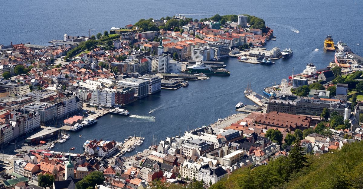 Clarion Hotel Admiral in Bergen: A 1904 Warehouse on the Waterfront Stunning aerial view of Bergen, Norway, showcasing the city's harbor and surrounding architecture.