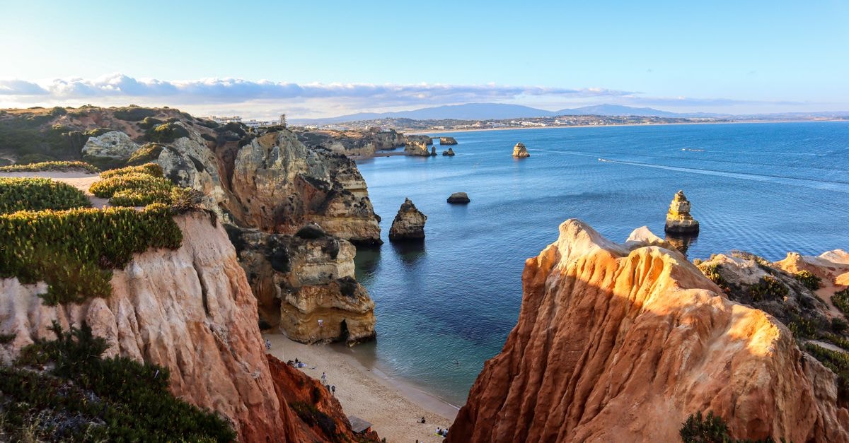 Ponta Grossa Travel Guide: Planning Tips, Costs and Things to Do Breathtaking view of the Algarve cliffs and Atlantic Ocean under a blue sky.
