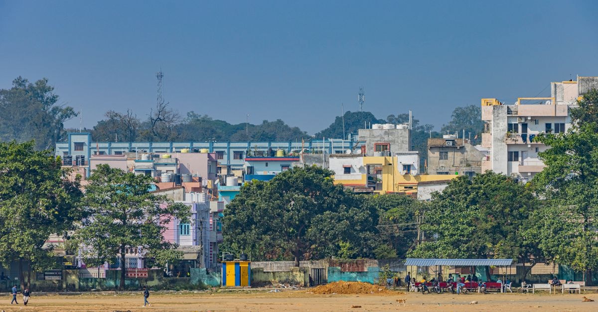 SPOT ON 71817 Hotel Paradise, Satna: Budget-Friendly AC Stay Colorful buildings and greenery in an urban area of Hazaribagh, India on a sunny day.
