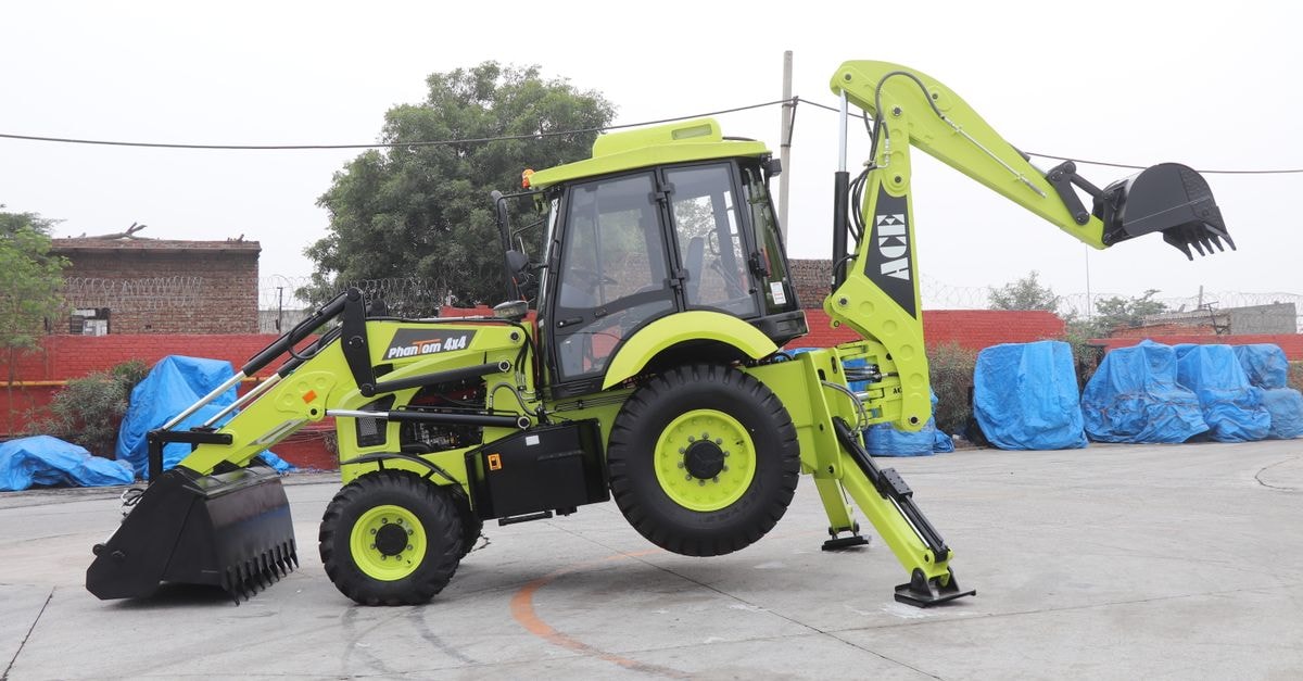 Townhouse Faridabad Railway Station Formerly Hotel Royals Paradise: Practical City Stay in Faridabad A vibrant ACE Phantom 4x4 backhoe loader is showcased in an outdoor setting in Faridabad, India.