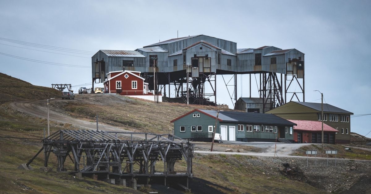 A Longyearbyen Travel Guide for the High Arctic Explore the unique industrial structures in Svalbard, Norway's remote village landscape.
