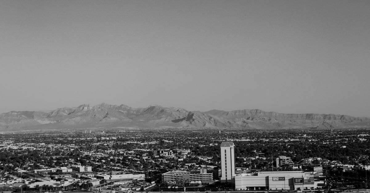 Renaissance Phoenix Downtown Hotel in Phoenix: A Downtown Base Near the Arena Black and white aerial shot of Las Vegas cityscape with mountains.