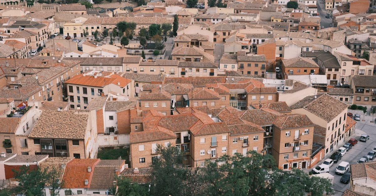 Onyx Luxury in La Romana: A Serene Poolside Retreat A captivating aerial view of Toledo, Spain showing traditional rooftops and historic architecture.