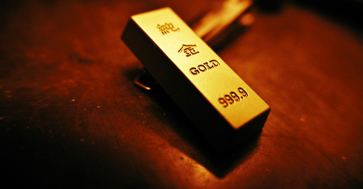 Gold jumps over 1% as US-Iran pause drags oil lower and lifts bullion A striking close-up of a gold bar showing inscriptions, captured with warm lighting.
