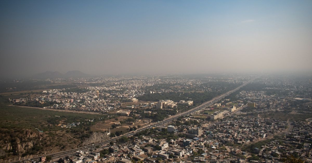 Hotel Bharatpur Town Residency in Bharatpur: A Chitwan City Stay Aerial view of Jaipur city, showcasing the expansive urban landscape under a clear blue sky.
