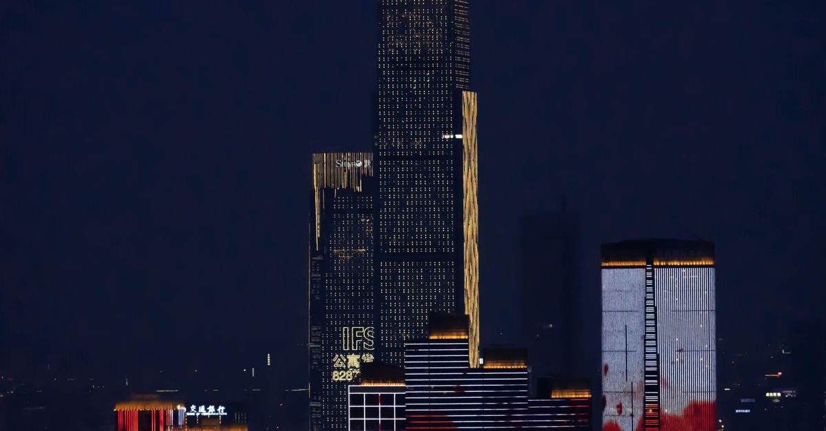 Cameron Hotel in Ile-Ife: A Stadium Road Sanctuary of Refined Luxury Stunning nighttime cityscape featuring illuminated skyscrapers in an urban setting.