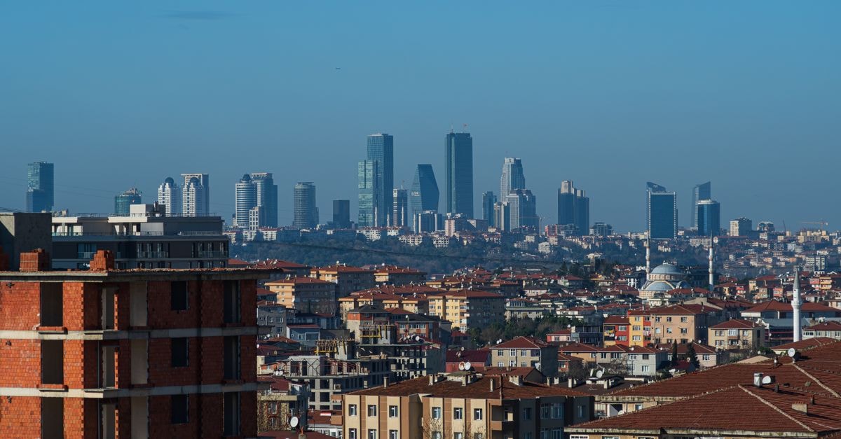 A wide view of İstanbul's cityscape showcasing both modern skyscrapers and traditional buildings.