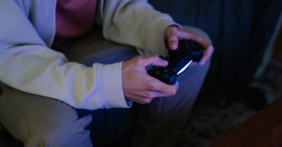 Pokémon Pokopia surpasses 5 million sales worldwide after first Expansion Pass part Crop anonymous male with modern console controller playing video game while sitting at home
