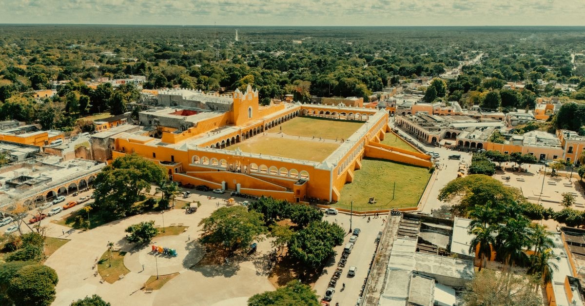 Stunning aerial view of the iconic yellow Convento de San Antonio de Padua in Izamal, Mexico.
