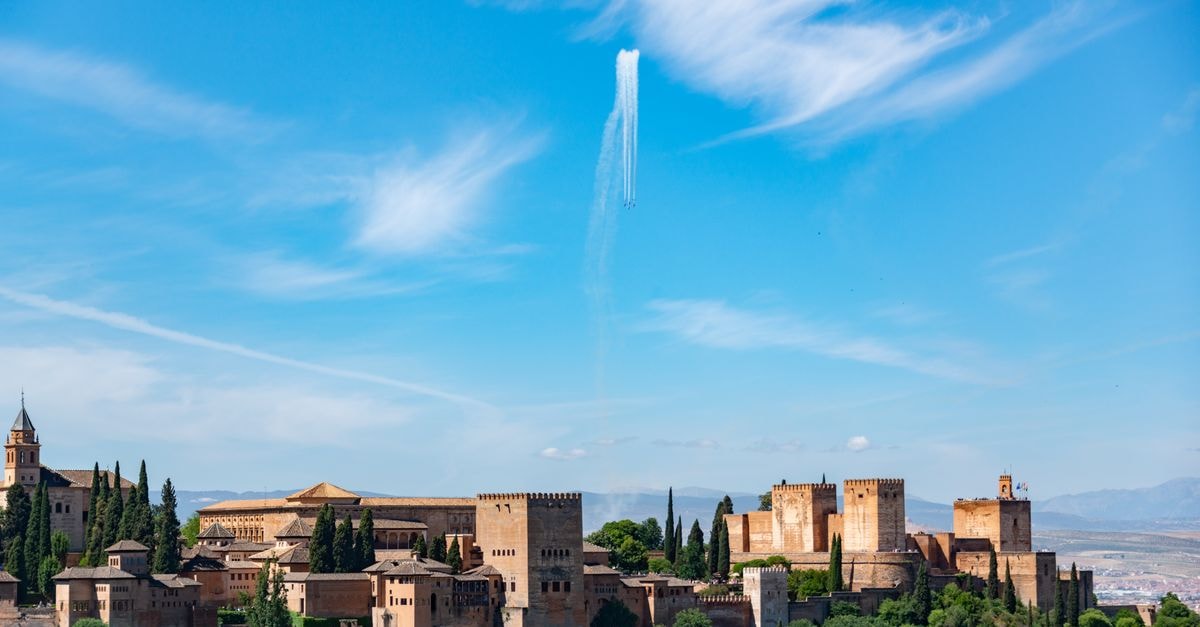 Stunning view of the Alhambra Palace set against a clear blue sky in Granada, Spain.