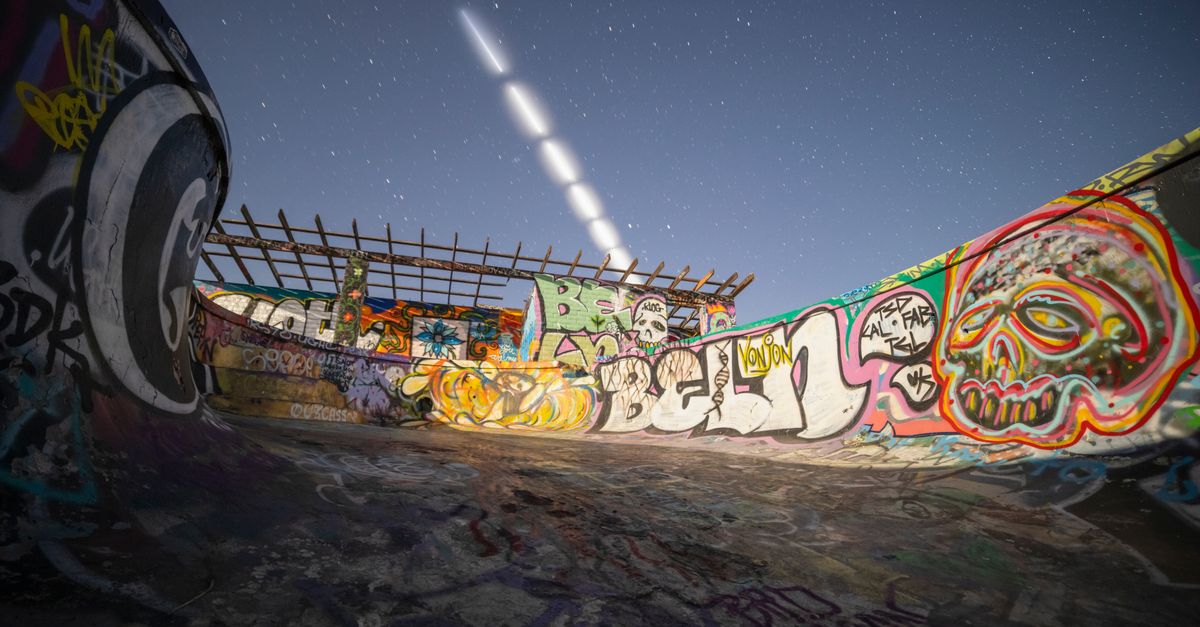 SpaceX's Starship survives reentry on Flight 13, deploying Starlink V3 satellites for the first time Dynamic view of a graffiti-covered skate park under a starry night sky with light trails.