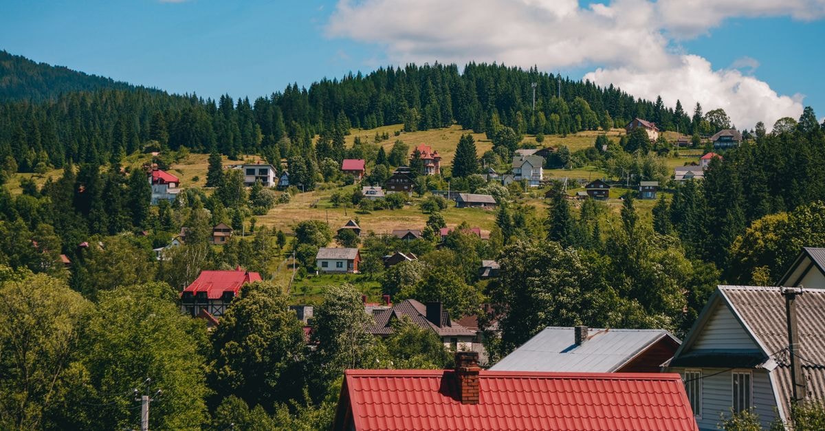Picturesque village landscape of Vorokhta, Ukraine during summer under blue skies.
