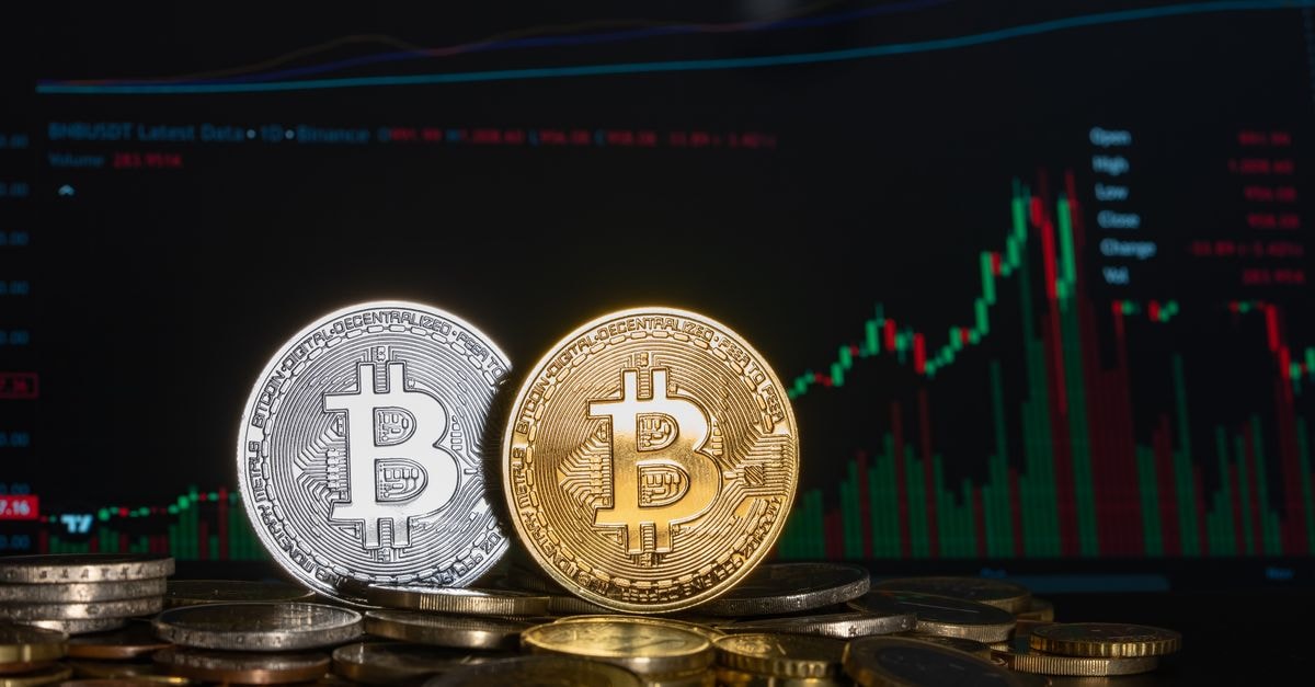 Nepal gold price drops Rs 900 per tola as global market heads for monthly gain Golden and silver Bitcoin coins against a financial graph display, highlighting cryptocurrency investment trends.