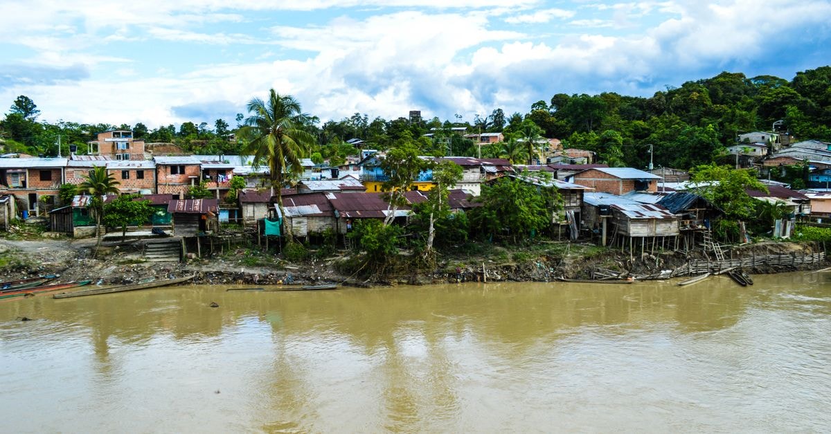 Hotel Miami in Puerto Limón: A Walkable Stay Near Los Baños Beach Aerial view of the rural riverside town of Puerto Nuevo, Chocó, Colombia.