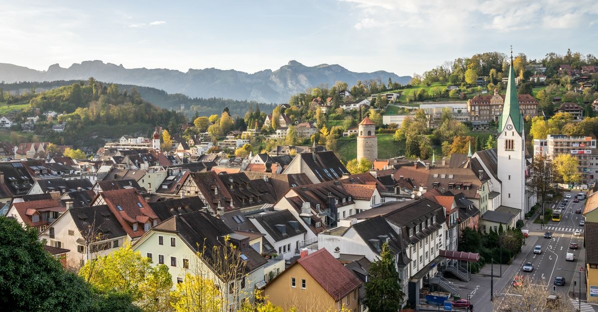 Beautiful panoramic view of Feldkirch, Vorarlberg, Austria with historic buildings and mountainous backdrop.