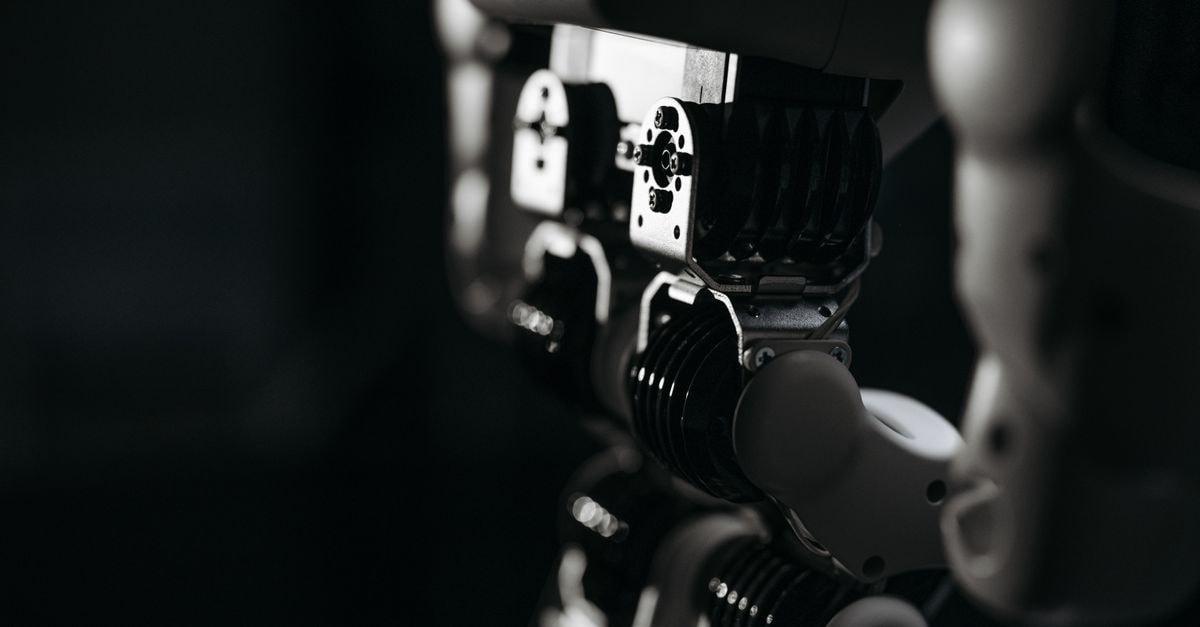 Google DeepMind Unveils Gemini Robotics 2 as Naver and MIT Push Robot Software Forward Detailed close-up of a robot's mechanical components, emphasized by moody studio lighting.