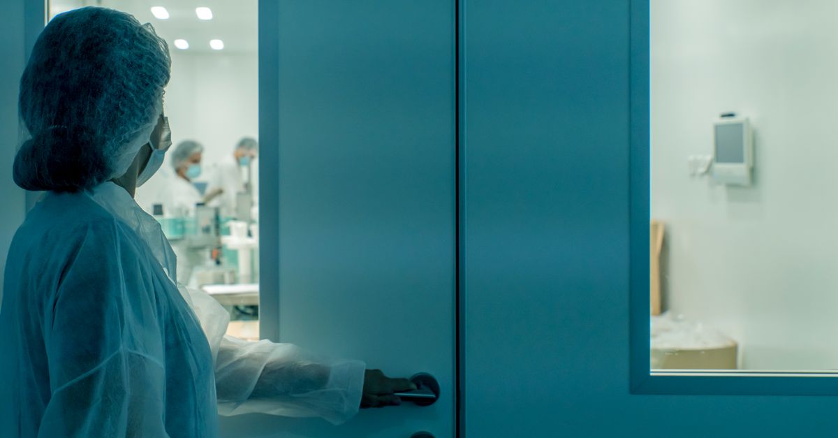 Researchers disclose RefluXFS race condition in Linux XFS enabling root access A scientist in protective gear enters a sterile laboratory environment, ensuring cleanliness.