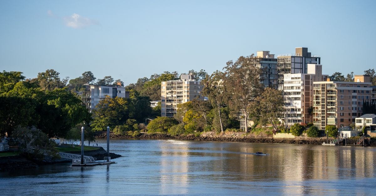 Hampton Inn Riverside Downtown in Riverside: Steps to the Convention Center View of modern apartment buildings along the Brisbane River in Queensland, Australia during daytime.