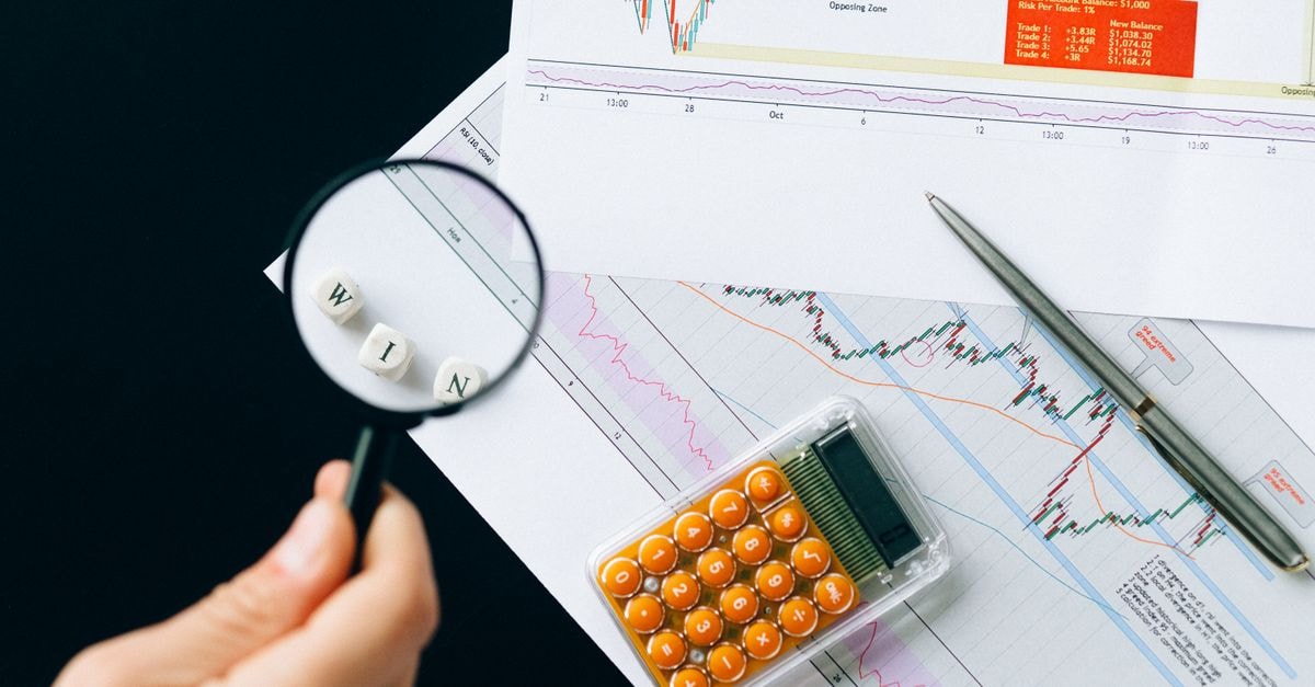 Zacks Research Downgrades Texas Instruments to Hold Magnifying glass highlighting the word 'WIN' over financial charts. Enhance your business analysis vision.