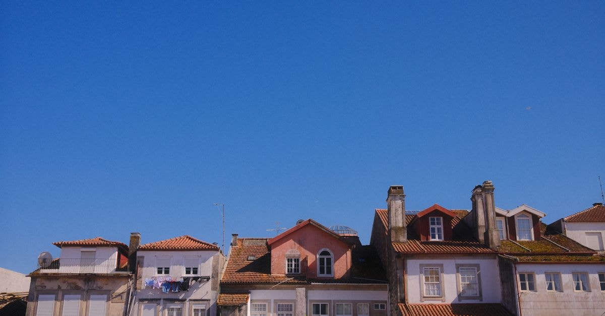 AP Dona Aninhas, Viana do Castelo — A Boutique Stay Woven With Local Craft Picturesque view of colorful rooftops against a clear blue sky in Viana do Castelo, Portugal.