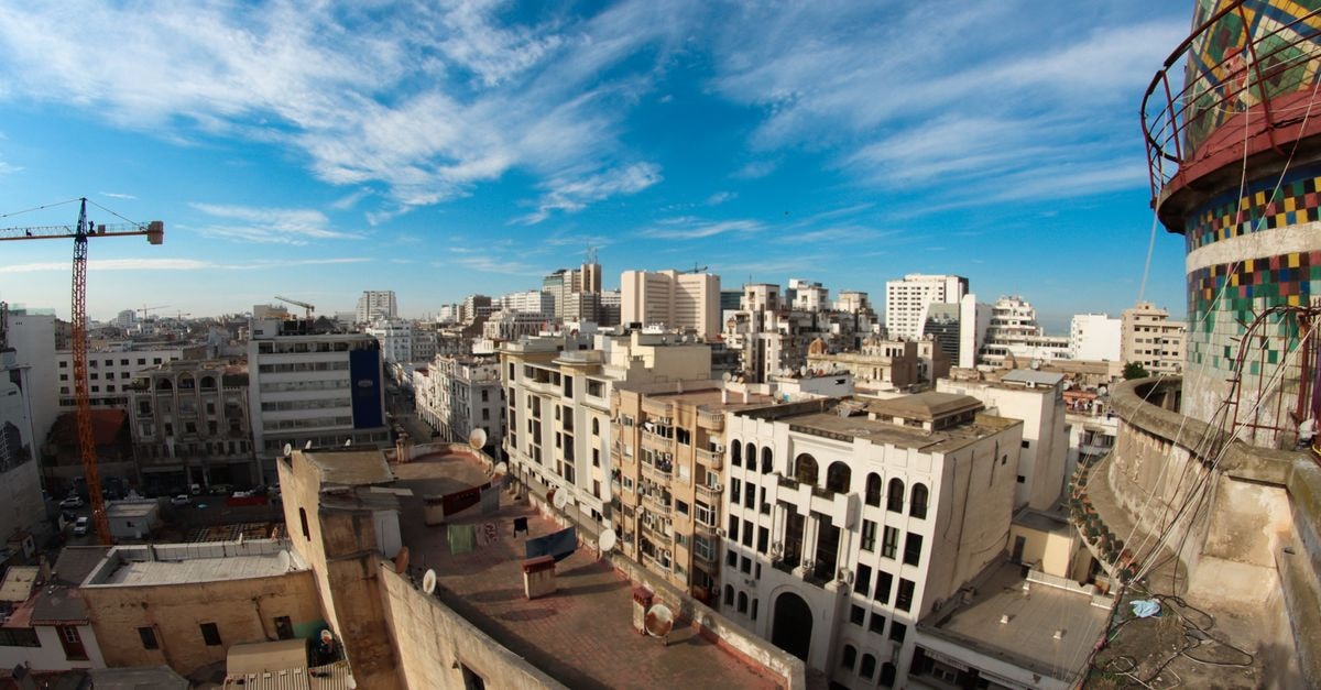 Business Hotel Sfax in Sfax: Avenue 5 Août Address with Tunisian Breakfast Buzz High-angle view of Casablanca's urban skyline under a vibrant blue sky.