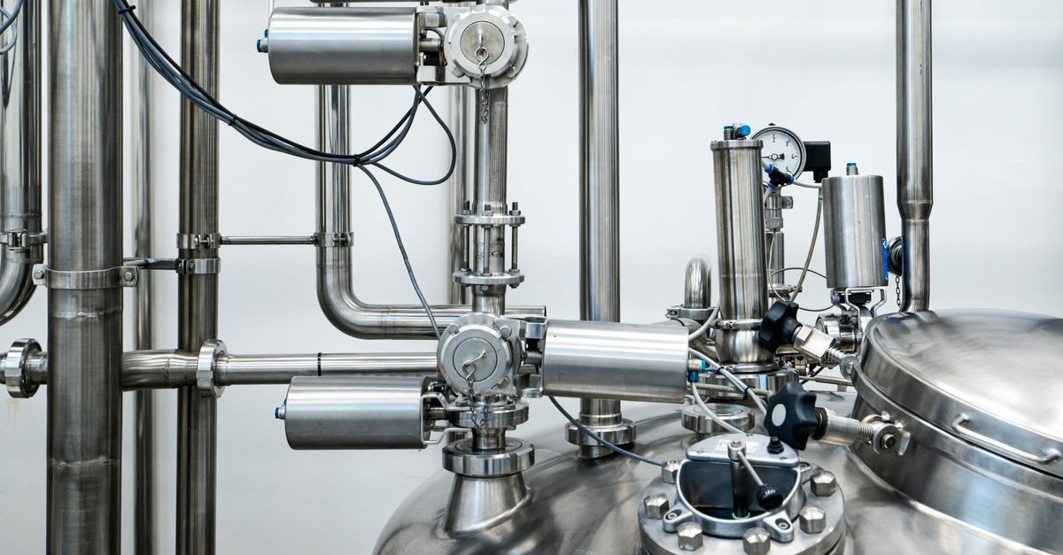 Kadant Inc.: A Parts-and-Consumables Compounder Priced Near Its Growth Story Close-up of stainless steel machinery and pipes in an industrial setting, showcasing modern engineering.
