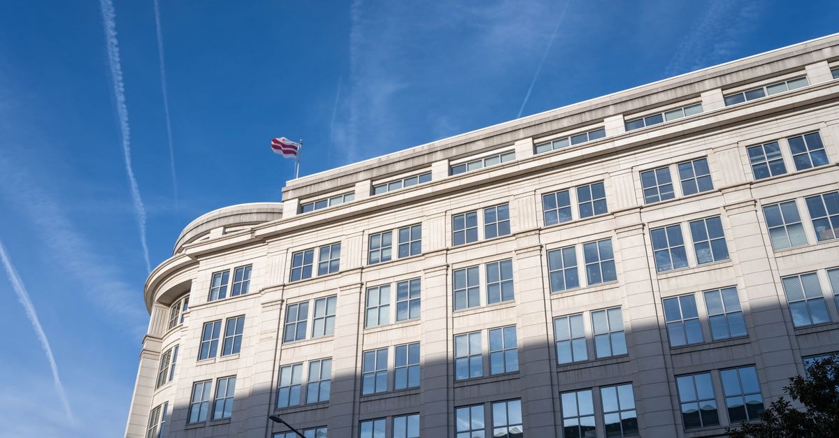 Clear Channel Outdoor: OOH Cash Flow With a Pending Take-Private Elegant office building under a clear blue sky in Washington, D.C.