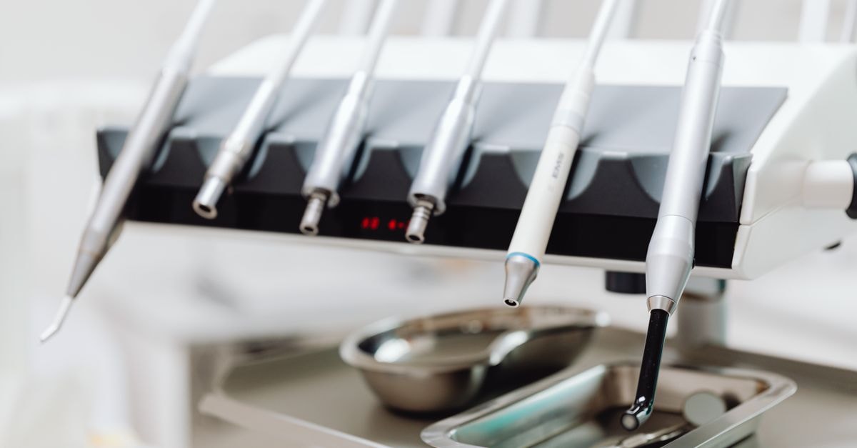 High-tech dental tools and instruments in a dental clinic setting, showcasing advanced healthcare technology.