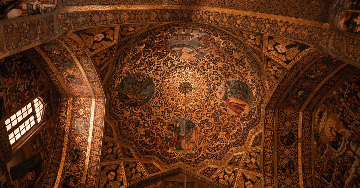Discovering Isfahan: a slow travel guide to Iran's jewel Detailed view of the ornate ceiling in Vank Cathedral, showcasing Persian and Christian motifs.