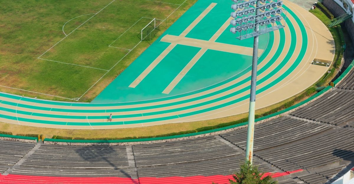 Radisson Hotel Del Rey Toluca in Mexico: A Tollocan Rebrand Worth Knowing Aerial photograph of an outdoor sports track and stadium in Toluca de Lerdo, Mexico, capturing vibrant colors and athletic design.