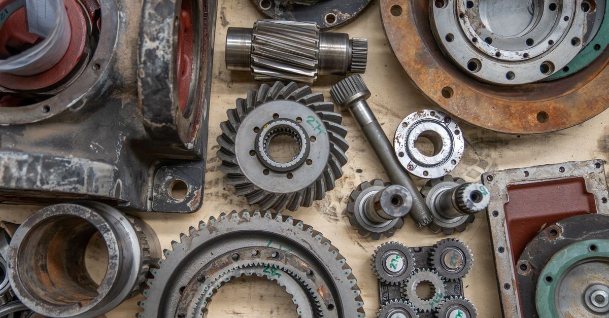 Cognex Corporation: Premium Franchise, Pricey Ticket Detailed shot of industrial gears and mechanical parts in a workshop setting.