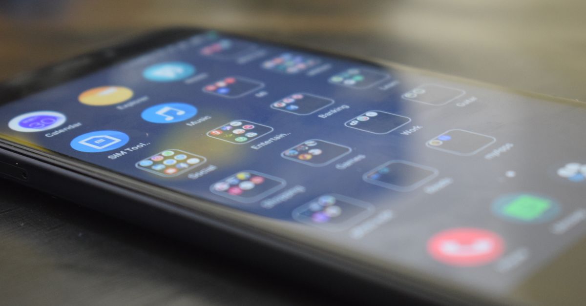 Qualcomm to Raise Chip Prices by Double Digits from September 1, Pressuring Android Phone Makers Close-up shot of a smartphone screen showing various app icons, indicating digital technology use.