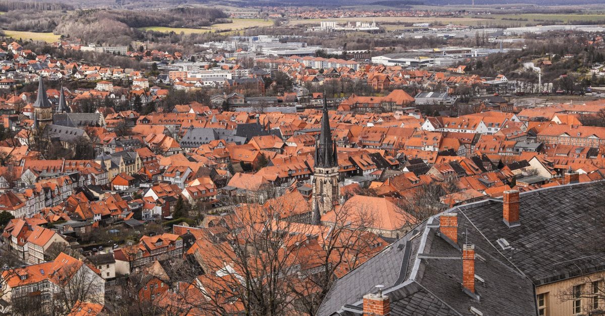 Hotel Rhyhof in Frauenfeld: Bakery Heritage Meets Chef-Led Dining Aerial view of Wernigerode showcasing red-tiled roofs and historical architecture.