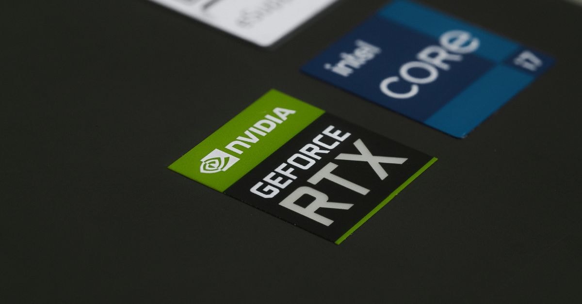 Dell Pro 5 14 Review Tests Intel Core Ultra X7 368H in 14-Inch Business Laptop Close-up of NVIDIA GeForce RTX and Intel Core i7 stickers on a laptop surface, showcasing modern technology.