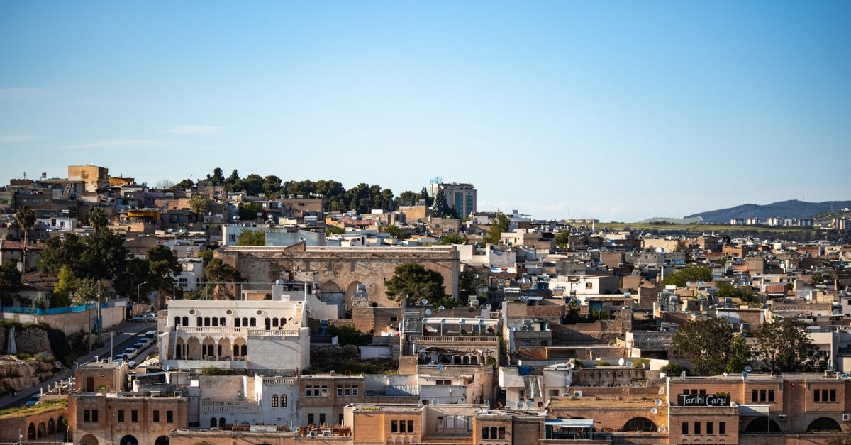 Rénéa Hotel in Sétif: Entertainment-District Stay with Park Mall and Citadel Nearby Aerial view of historic Sanliurfa showcasing traditional architecture and vibrant landscapes.