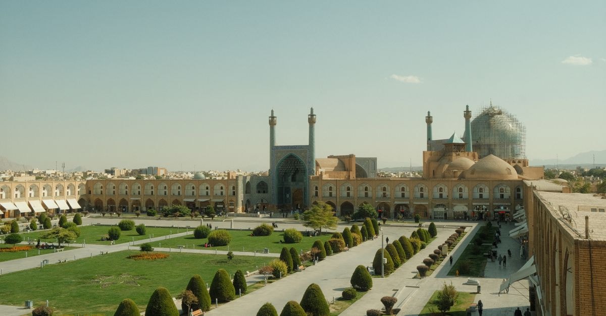 Aerial view of Naqsh-e Jahan Square in Isfahan, showcasing Persian architecture and gardens.